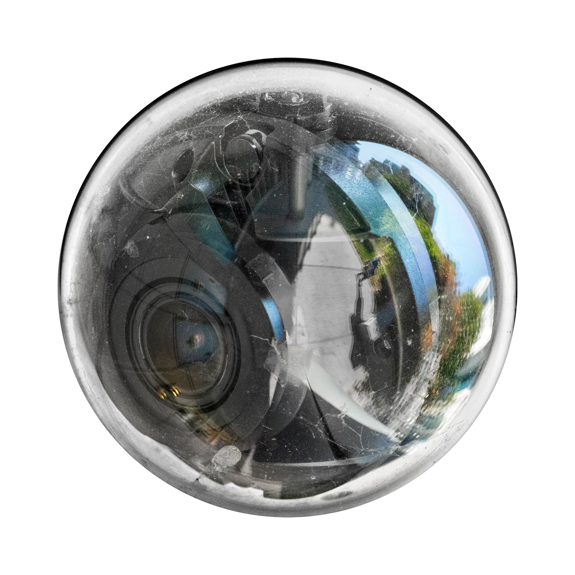): Distorted reflection of urban area and walkway in a circular security camera lens.