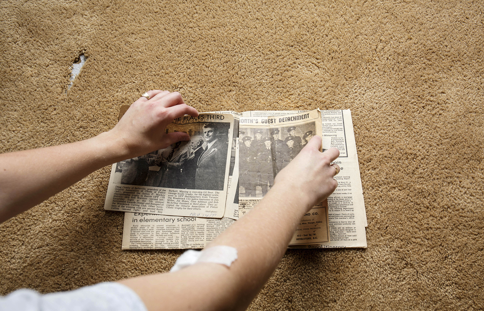 CARE NOW: Hands grabbing newspaper