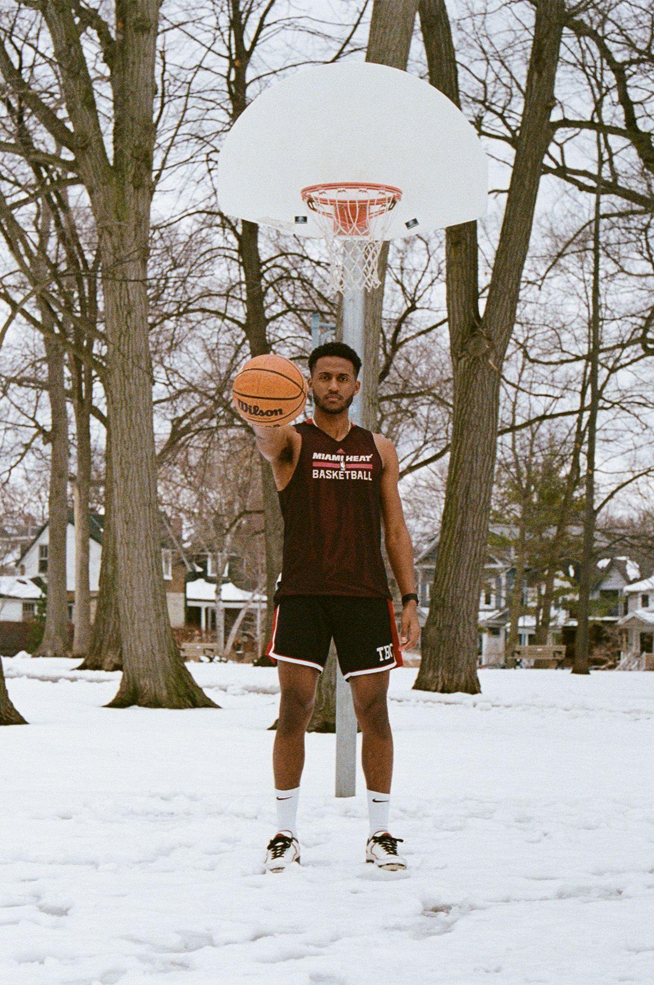 Basketball: A picture of my friend Feli holding a basketball on a snowy court