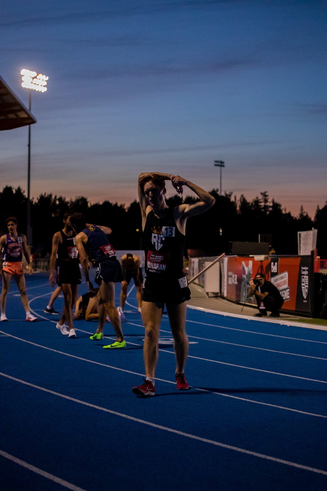 Running: Exhausted runner in a track and field stadium