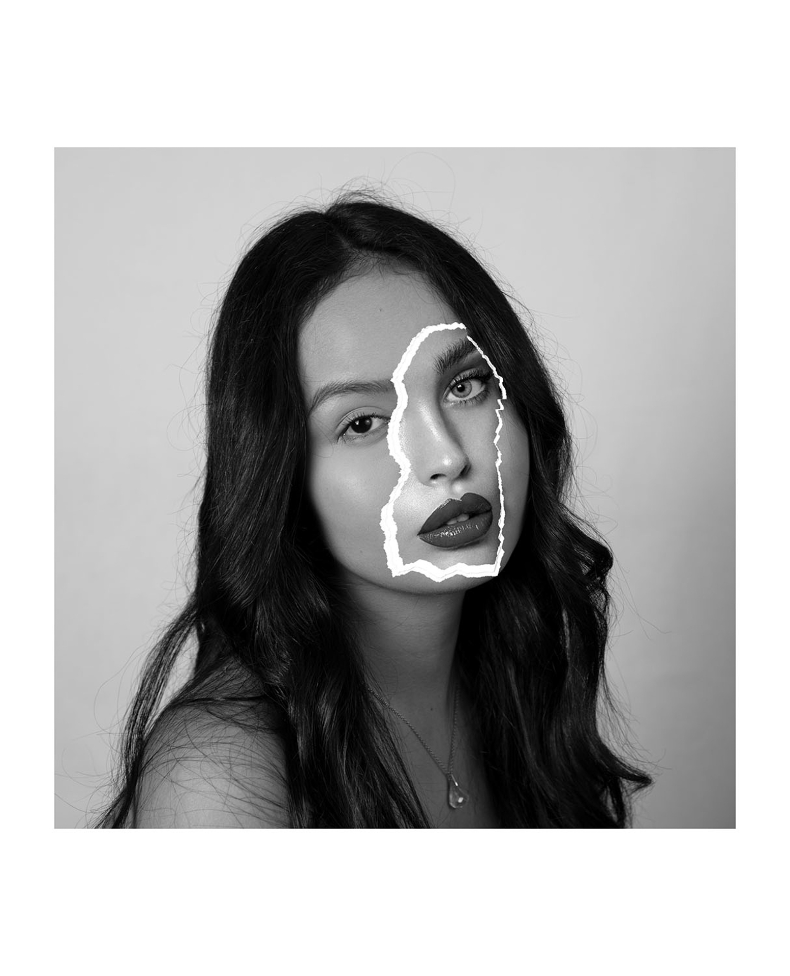 Swieczka_Kornelia_02 - Kornelia Swieczka This photo is a portrait of a woman with no-makeup and black hair with a paper patch of another woman’s face on top of hers. This woman appears to be wearing make-up and is only shown as a torn piece of paper covering a part of the first woman’s face.