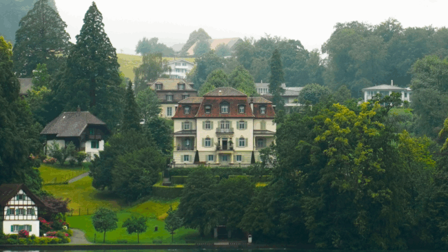 An old Swiss house standing on a hill on Lake Lucerne in lucerne Switzerland.