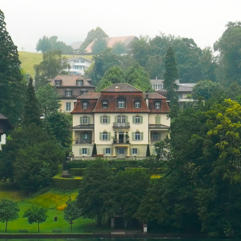 An old Swiss house standing on a hill on Lake Lucerne in lucerne Switzerland.