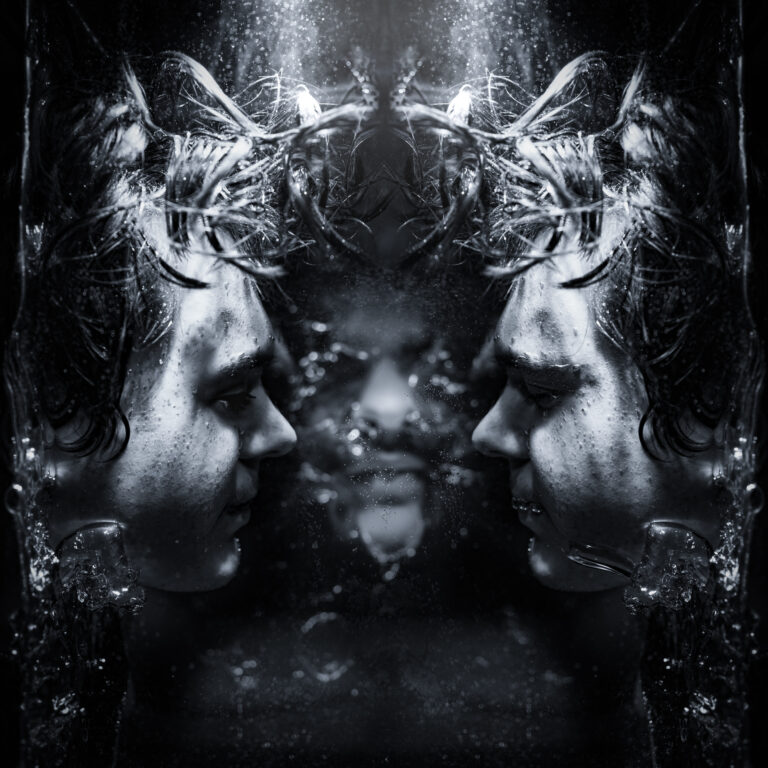 A black-and-white surreal portrait featuring a person submerged in water, their face mirrored and distorted.