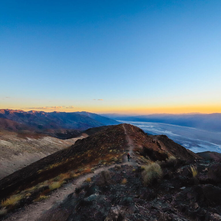 A lone hiker takes in panoramic Dante’s View at sunset in Death Valley National Park, California.