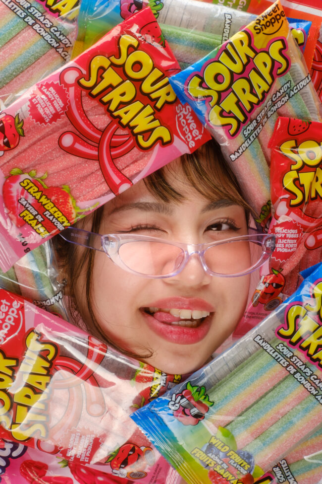 Face surrounded by candy.