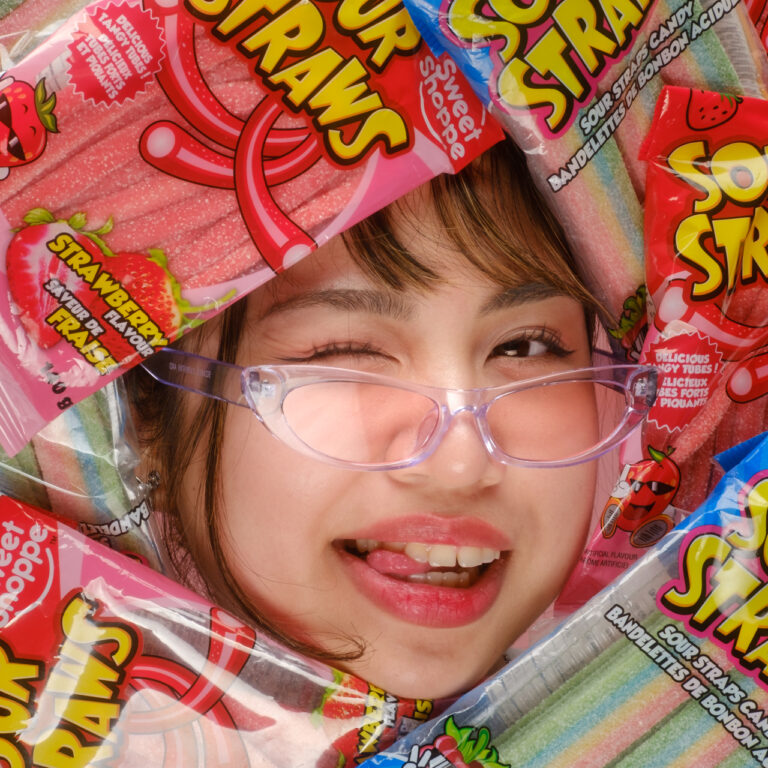 Face surrounded by candy.